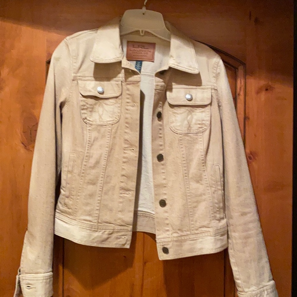 Tan colored jean jacket...Has a little stretch in the arms